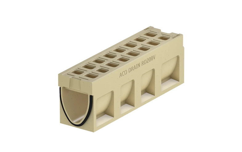 Beige monolitisk markränna med tätning samt små hål på ovansidan.