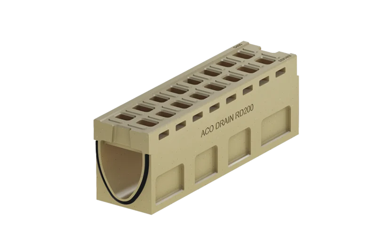 Beige monolitisk markränna med tätning samt små hål på sida och ovansidan.