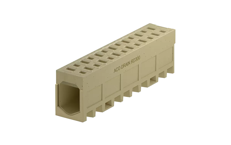 Beige monolitisk markränna med små hål på ovansidan.