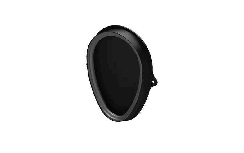 Svart oval med spetsig kant samt tät sida.
